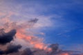 Background of blue sunset sky with dark clouds. For your inspirational inspiration text message or design backdrop. Royalty Free Stock Photo