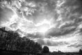 Sky is clouding over. Dramatic sky on urban landscape. Sun burst through clouds. Cloudy sky in city. Grey sky with Royalty Free Stock Photo