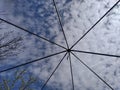 sky with clouds behind bars, lattices