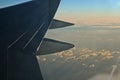 Sky and clouds at dusk from aircraft window Royalty Free Stock Photo