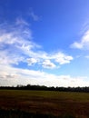 Sky clouds field trees prtty Royalty Free Stock Photo