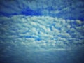 Sky with clouds. Meteorology, climate.Sky with clouds.White, fluffy clouds in blue sky.Sun rays and clouds.