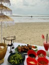 Dinner on the sky with clouds over the blue sea and china umbrella