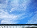 Sky and clouds over roof