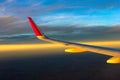 Sky clouds plane wings flying sunset travelling Royalty Free Stock Photo