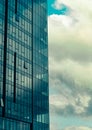 Sky with clouds reflected in windows of modern office building Royalty Free Stock Photo