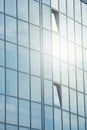 Sky and clouds reflected in the windows of a modern office building, glass building Royalty Free Stock Photo