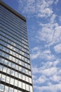 Sky and clouds reflecting in skyscraper windows low angle view