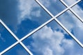 Sky clouds reflection in office building glass window Royalty Free Stock Photo