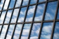 Sky and clouds reflection in the windows of modern building. Building exterior, glass Royalty Free Stock Photo