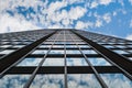 Sky and clouds reflection in windows of skyscraper Royalty Free Stock Photo