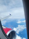 the sky and clouds are very beautiful seen from inside the plane Royalty Free Stock Photo