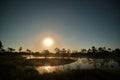 Moon set observingn over lake in Latvia Royalty Free Stock Photo