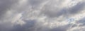 The sky is covered with dense gray clouds, panorama