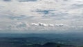 Sky covered by graceful clouds over the green mountains Royalty Free Stock Photo