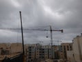 A Sky of Cranes on building site in Malta on a windy day Royalty Free Stock Photo