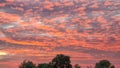 The sky at dawn as the sun rises from the horizon with beautiful bright colors Clouds and fog spread all around. The landscape and