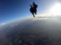 Sky dive tandem friends at the sunset Royalty Free Stock Photo