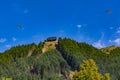 Sky divers and paragliders on the mountain of Queenstown. Royalty Free Stock Photo