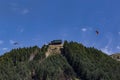 Sky divers and paragliders on the mountain of Queenstown. Royalty Free Stock Photo