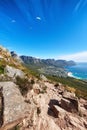 Sky divers paragliding over rocky mountain trail for tourists seeking a thrill is a great activity to explore when on Royalty Free Stock Photo