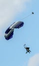 Sky diving tandem parachutists gliding toward landing Royalty Free Stock Photo