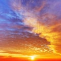 Sky with dramatic cloudy sunset and sun Royalty Free Stock Photo