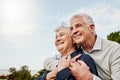 Sky, elderly couple and hug outdoors or happy in retirement or husband and wife in nature. Mature, man and woman smile Royalty Free Stock Photo