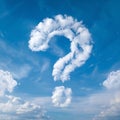 Sky with fluffy clouds, prominent question mark shaped cloud evokes curiosity Royalty Free Stock Photo