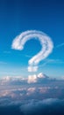 Sky with fluffy clouds, prominent question mark shaped cloud evokes curiosity Royalty Free Stock Photo