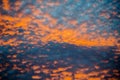 clouds glow from a colorful setting sun Royalty Free Stock Photo
