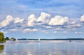 Sky with gigantic clouds over a lake with sailing boats and motor boats Royalty Free Stock Photo