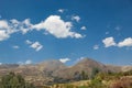 Sky and gray mountains.