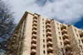 Sky-high serenity. Contemporary apartment building against partly cloudy sky. Royalty Free Stock Photo