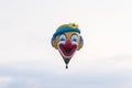 In the sky hot air balloon in the shape of a clown`s head at the hot air balloon festival