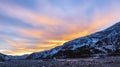 Sky landscape with orange clouds over the floodplain of  mountain river at sunset Royalty Free Stock Photo