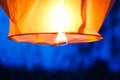 Sky lantern with burning fire. Blue sky. Close up