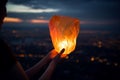 Sky lantern hand. Generate Ai Royalty Free Stock Photo