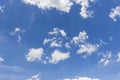 White clouds in blue sky background.