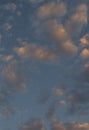 Sky with moving clouds lit by the sun and a blue background