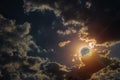 Sky nightly with large moon and eerie white clouds