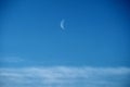 Moon and clouds observing on blue ksy Royalty Free Stock Photo