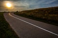 Sky over empty asphalt road during Sunset. Field of golden Royalty Free Stock Photo