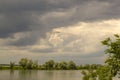 The sky is overcast before the rain. Gray storm clouds in the sky above the river Royalty Free Stock Photo