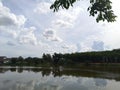 the sky painted in a soothing gray hue is adorned with a cluster of white clouds resembling a large water pond Royalty Free Stock Photo