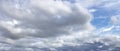 Sky panorama with dramatic clouds and blue section, wide view, weather forecast concept, classic background