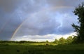 Sky and rainbow after thunderstorm over a wide country landscape Royalty Free Stock Photo