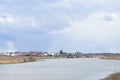 Sky, rainy storm clouds. Winding river Kostroma. Village on the banks of the river. The bell tower of the Church. Forest