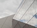 Sky reflected in glass of modern glass steel office building in Dublin, Ireland.