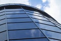 Sky reflected in a modern building blue glass facade Royalty Free Stock Photo